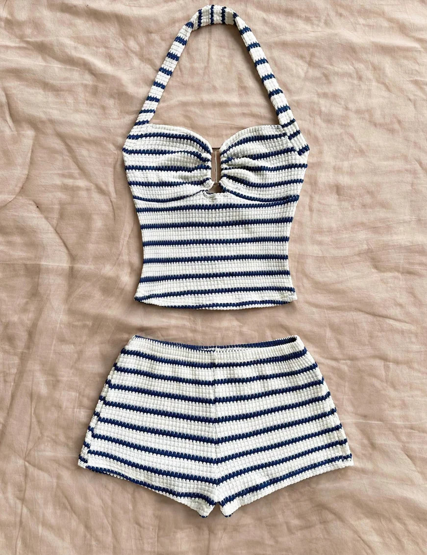 Blue summer two-piece set with halter top, knitted fabric, from Corporación Turística, perfect for warm weather wear.