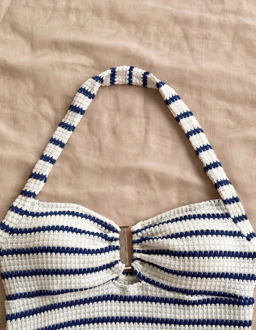 Blue summer two-piece set with halter top and knitted fabric, designed for warm weather wear by Corporación Turística.
