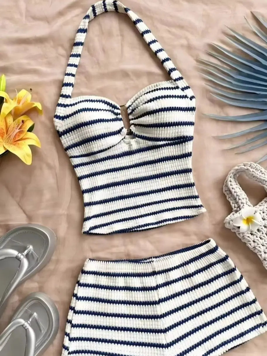 Blue summer two-piece set with halter top and knitted fabric, designed for warm weather, by Corporación Turística.