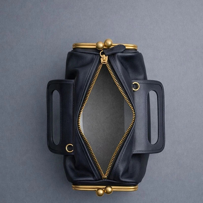 Blue PU shoulder bag with frame closure design, stylish and spacious, by Corporación Turística.