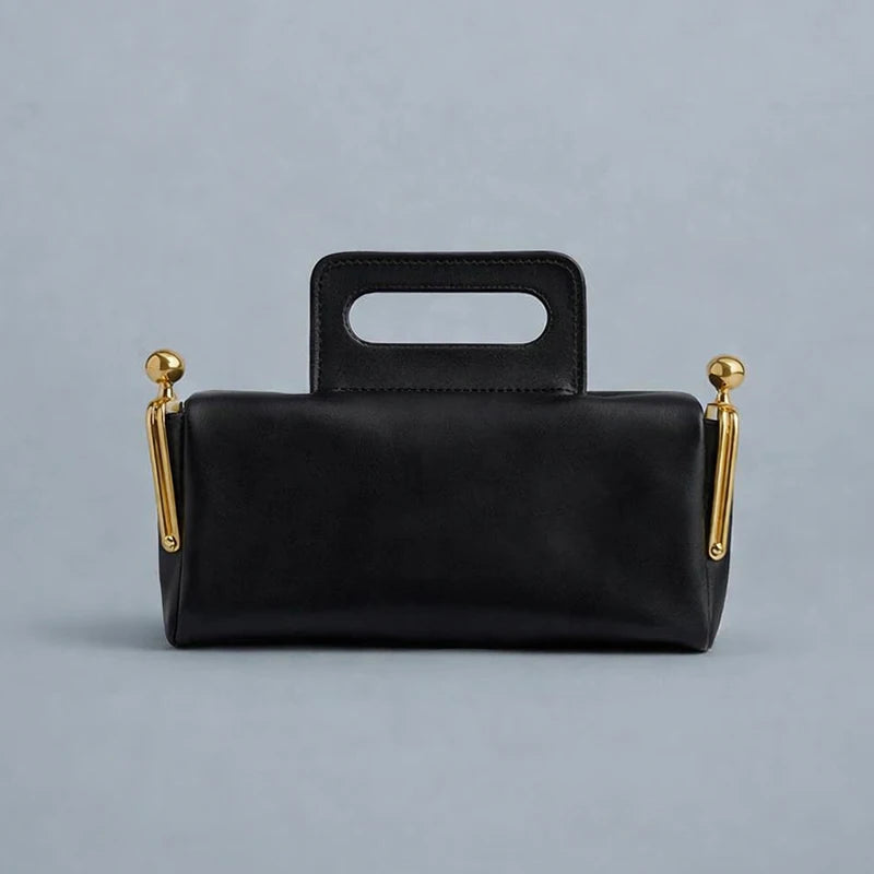 Blue PU shoulder bag with frame lock design from Corporación Turística, featuring a sleek, modern style and structured silhouette.