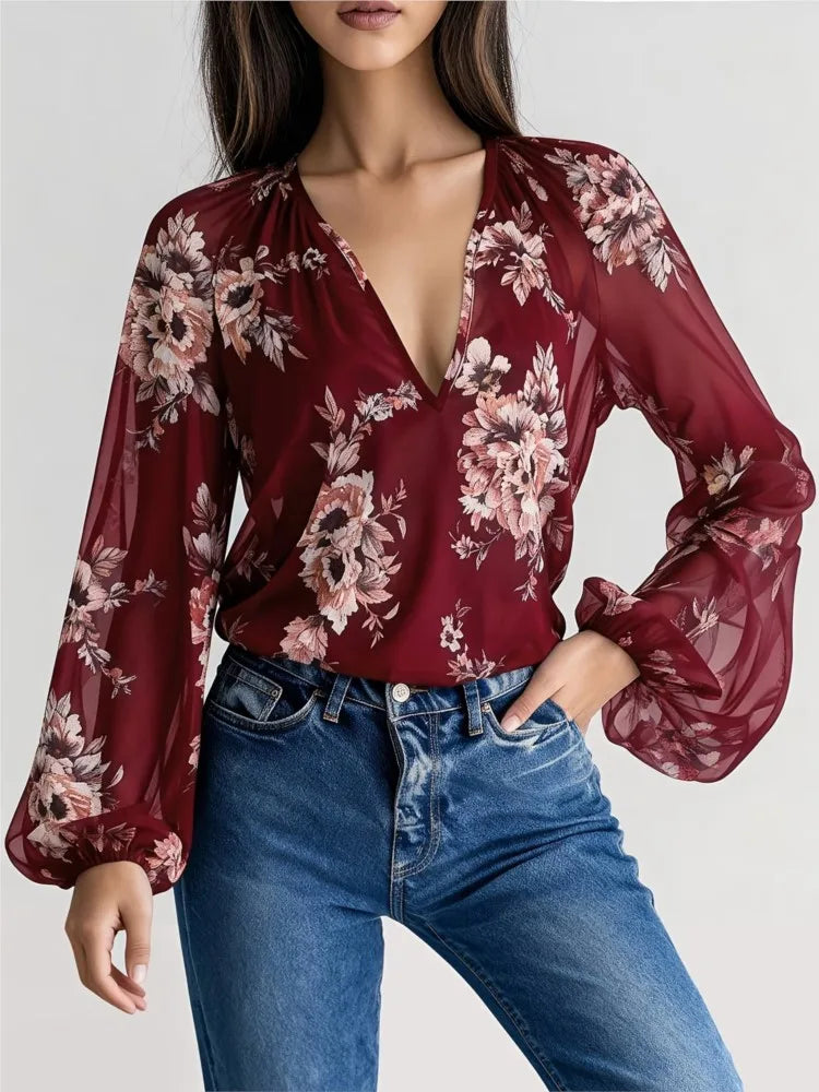 Blue sexy chiffon blouse with deep V-neck and floral print, featuring long sleeves and a relaxed fit from Corporación Turística.