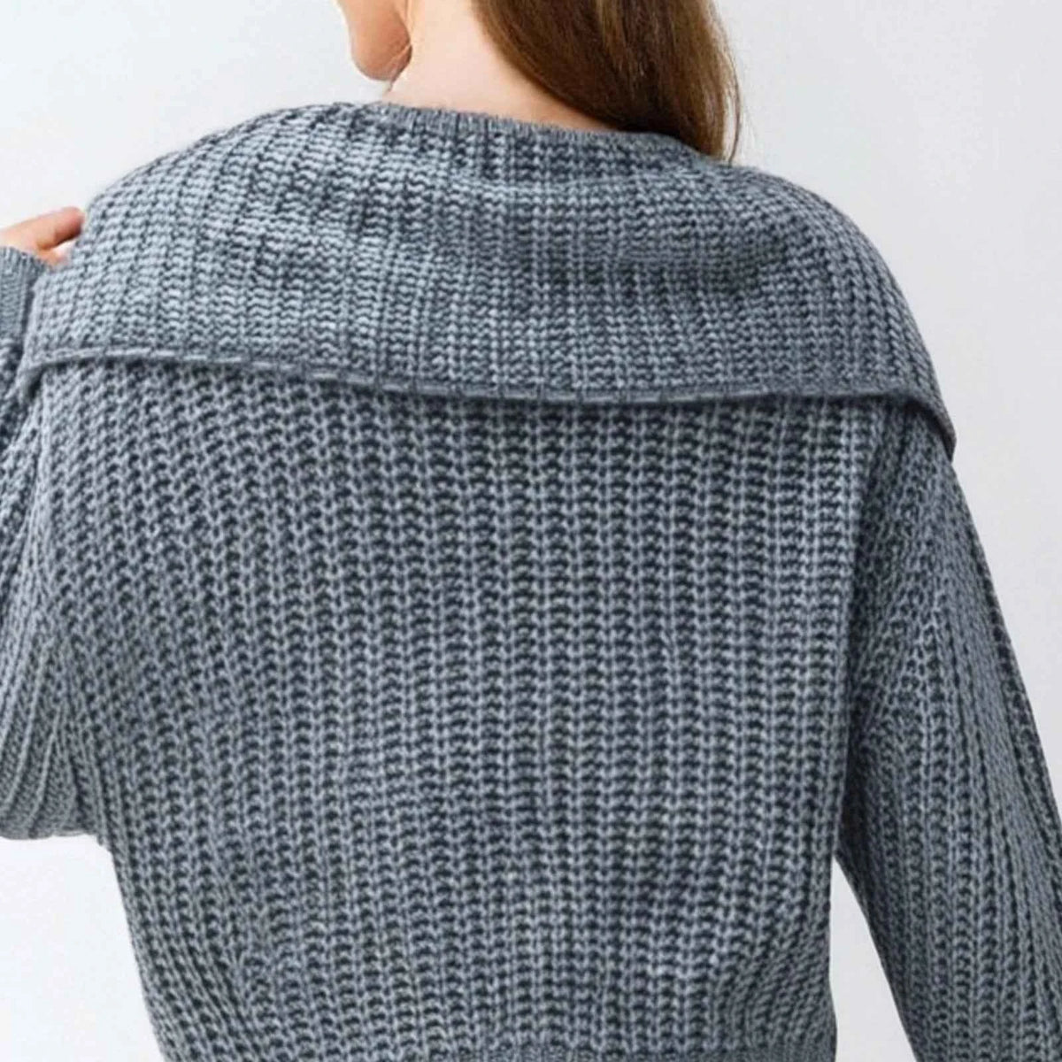 Blue women's knitted sweater with lapel from Corporación Turística, featuring a smooth, stylish knit fabric and classic design.