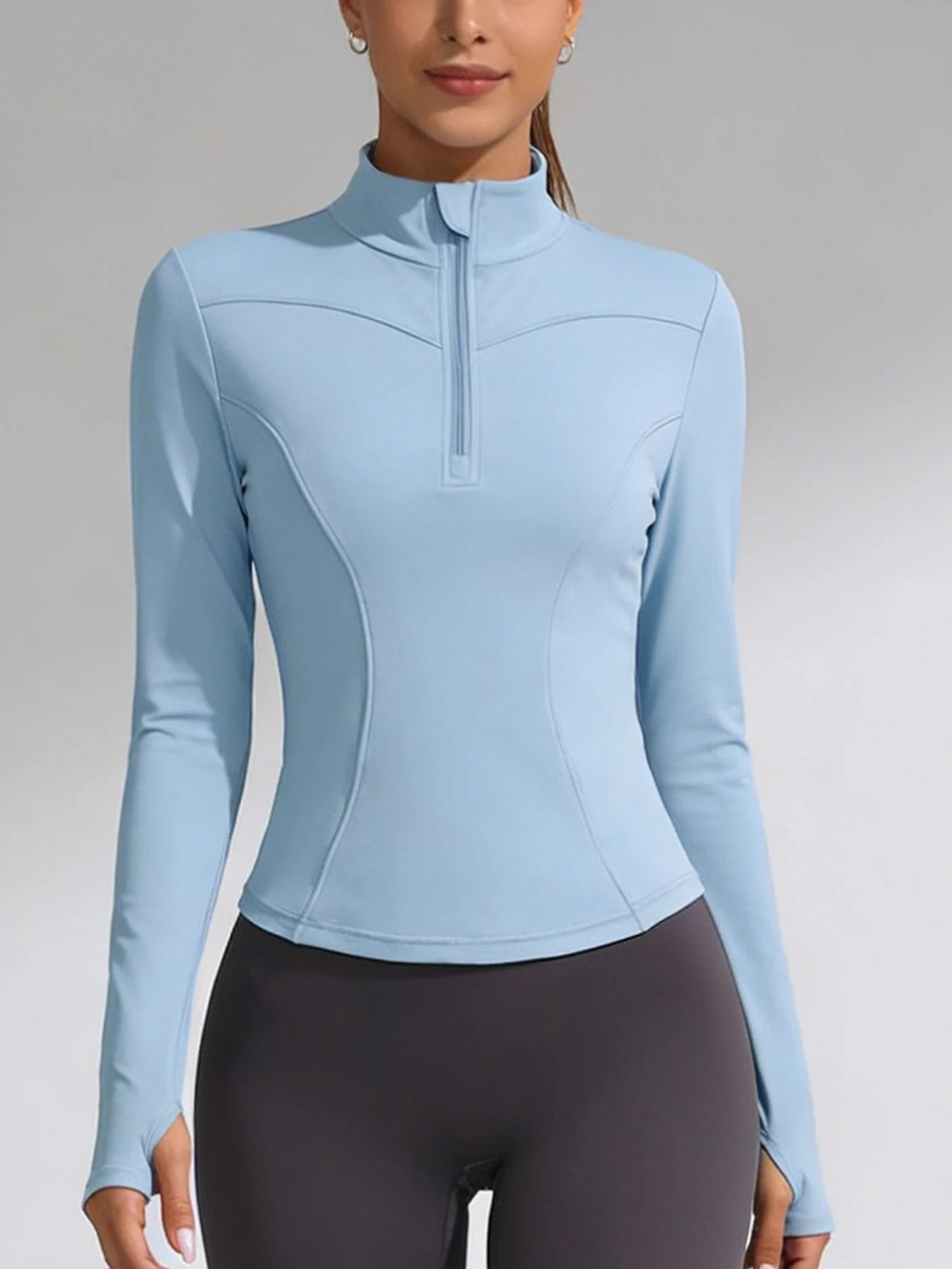 Blue women's fitted yoga sports T-shirt with short sleeves, made by Corporación Turística, ideal for active wear and exercise.