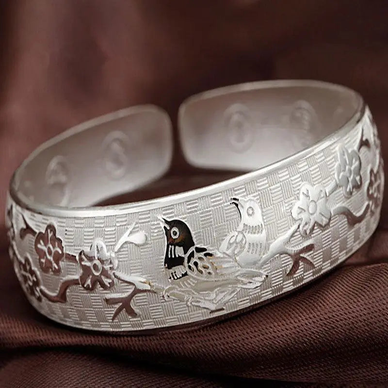 Open silver bangle bracelet for women made of 925 sterling silver, featuring a simple, elegant design.