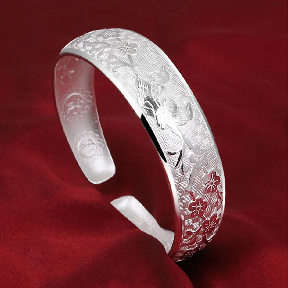 Simple sterling silver open bracelets for women, featuring sleek, minimalist design with a smooth finish and polished look.