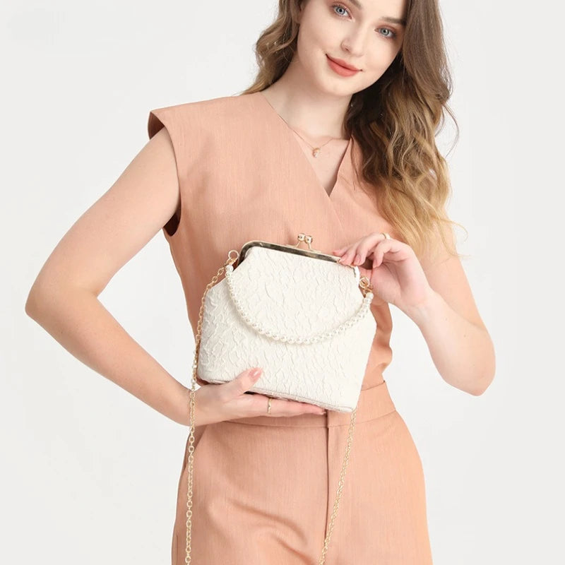 Beige crossbody phone purse with chain strap by Corporación Turística, compact and stylish for mobile essentials.