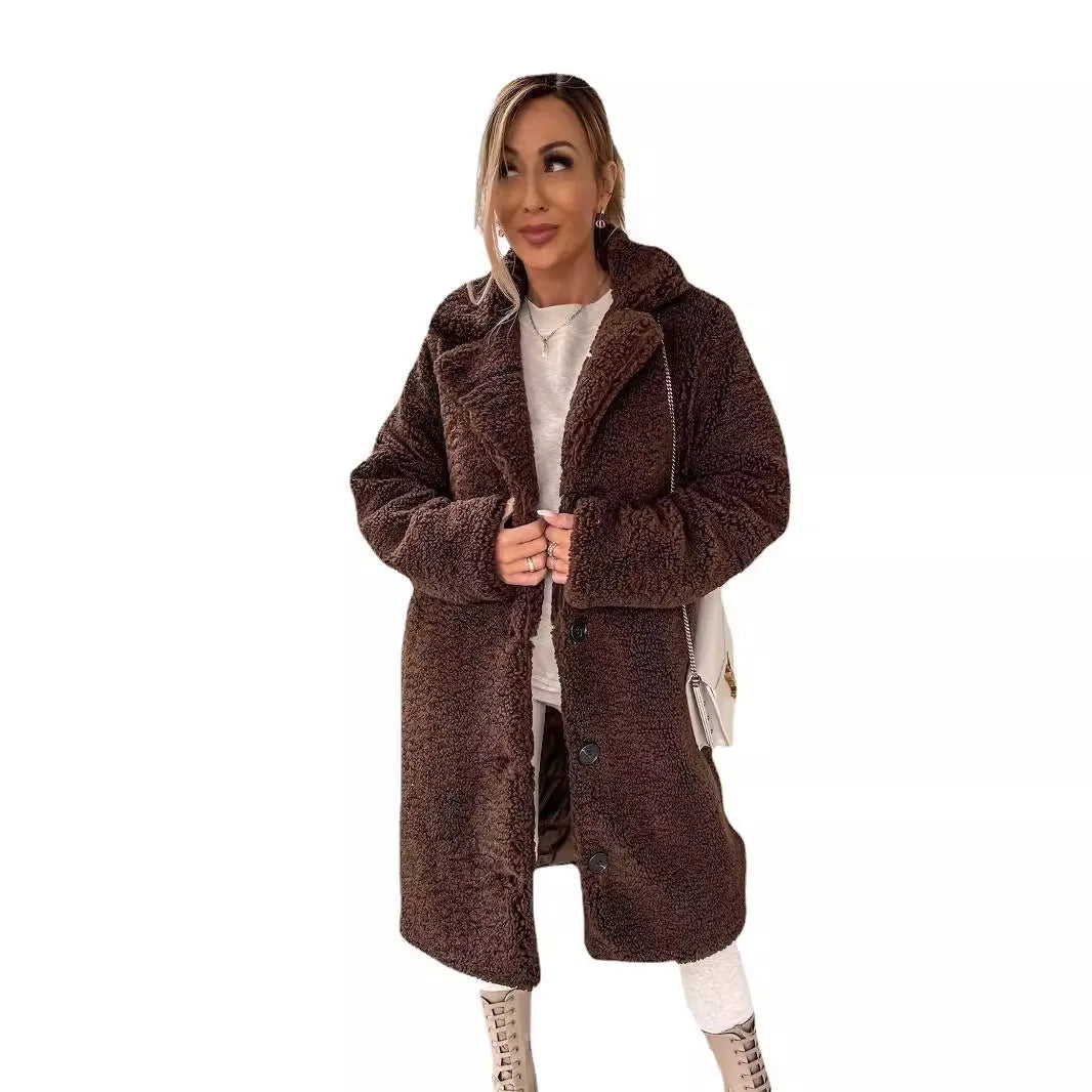 Beige long, loose, casual winter coat from Corporación Turística, with soft, thick, cozy, and plush fabric for warmth.