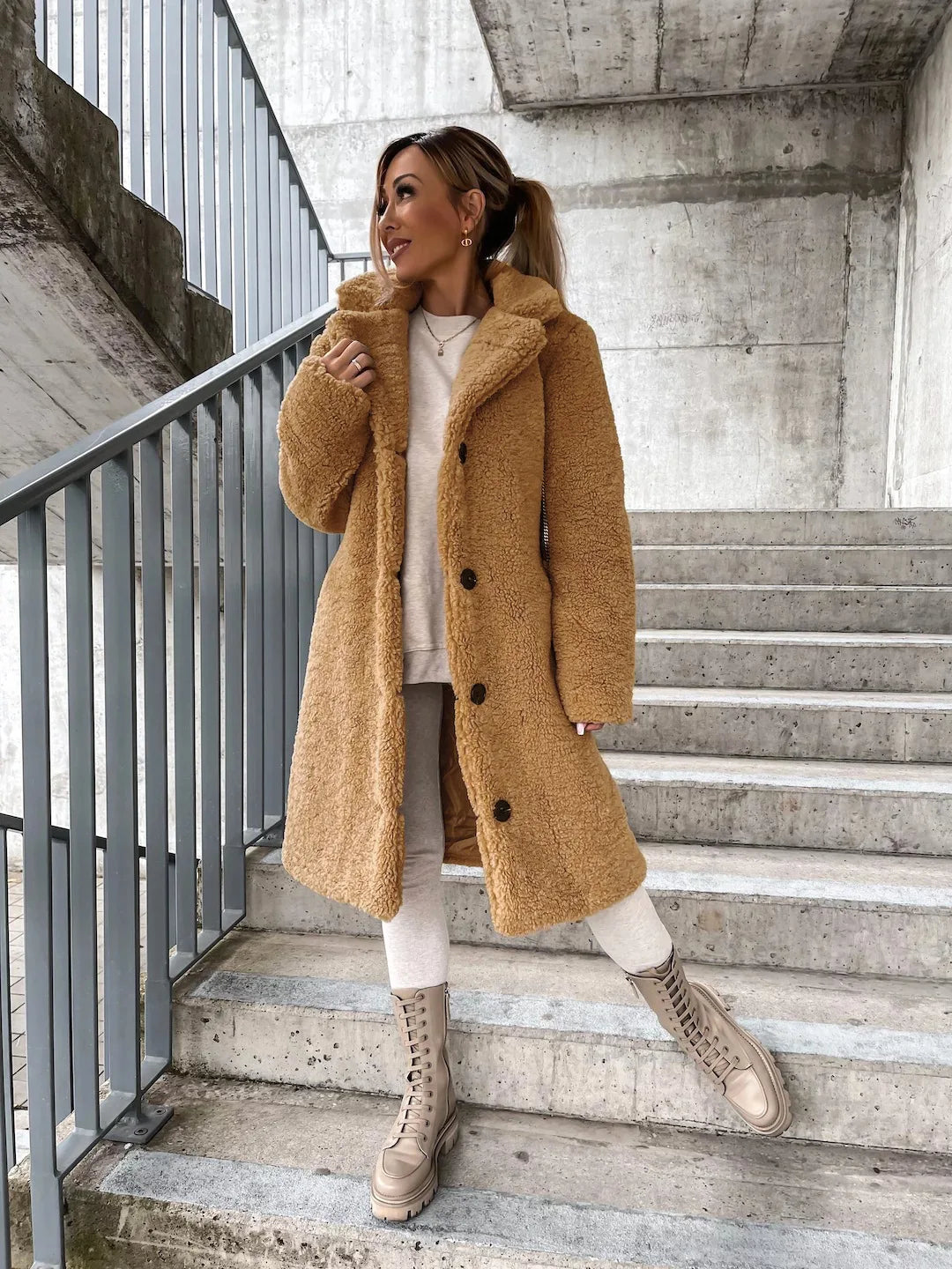 Beige long loose winter coat from Corporación Turística, soft, warm, thick, casual, and cozy for cold weather.