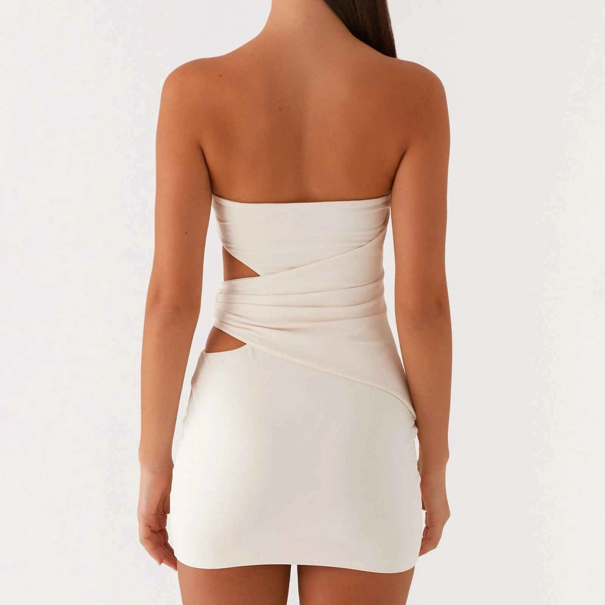 Beige strapless sexy dress for women, bandeau style, from Corporación Turística, shown on a model.