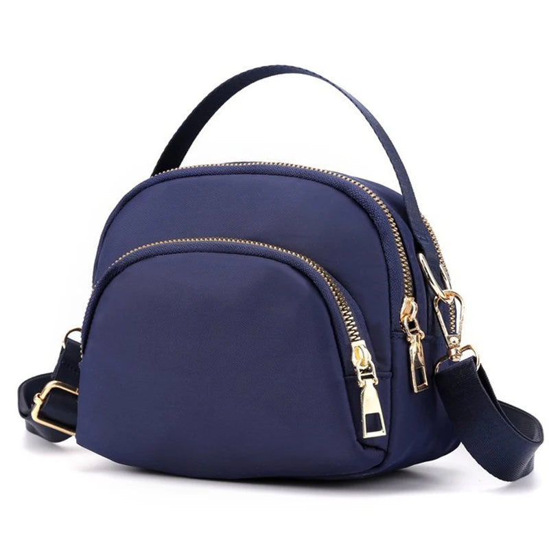 Red versatile modern shoulder bag for men and women by Corporación Turística, shown with adjustable strap and sleek design.