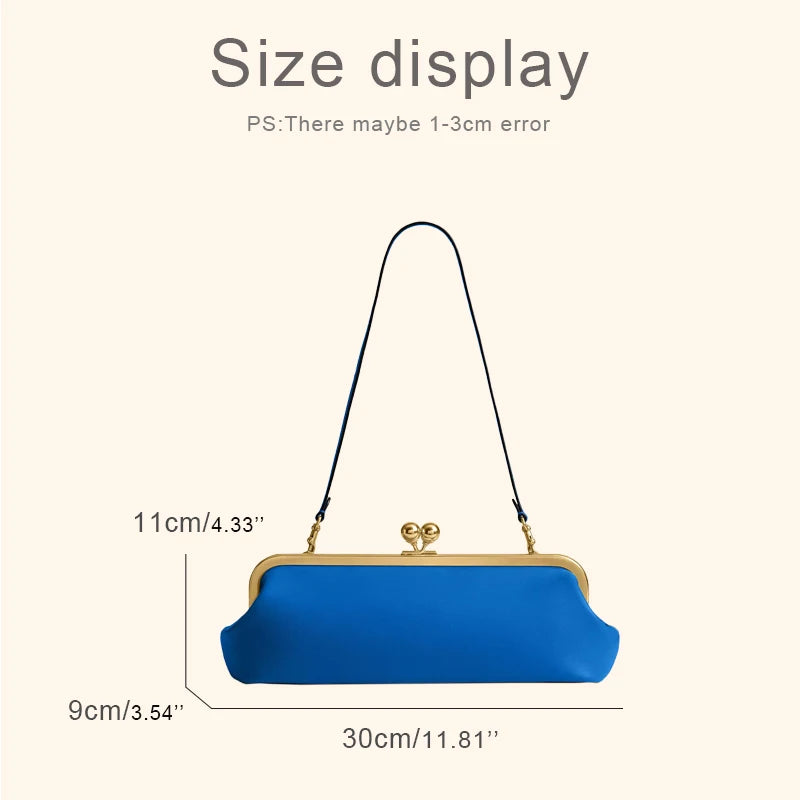 Black classic women's handbag with kiss lock closure, 30 cm long, featuring a sleek design and durable material.