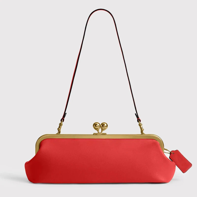 Black classic 30 cm women's kiss-lock handbag by Corporación Turística, featuring a sleek design and secure clasp closure.