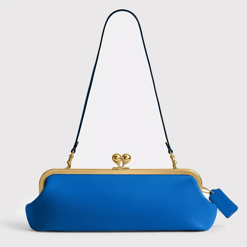 Black classic women's bag with kiss lock closure, 30 cm length, made by Corporación Turística.