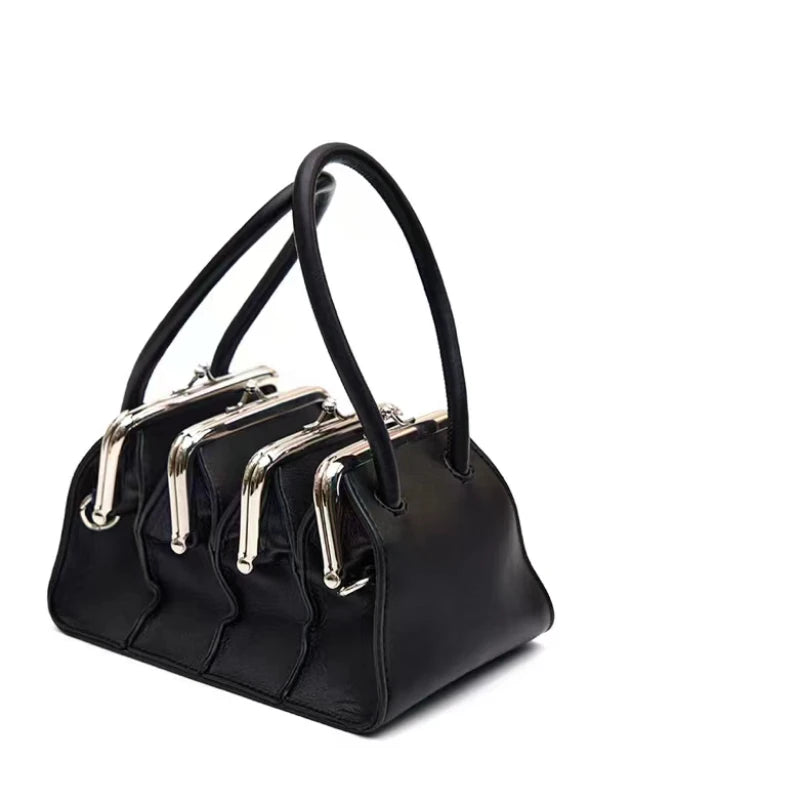 Black multi-layer shell clip clutch bag for women, 22cm by 19cm by 12cm, stylish and elegant handbag by Corporación Turística.
