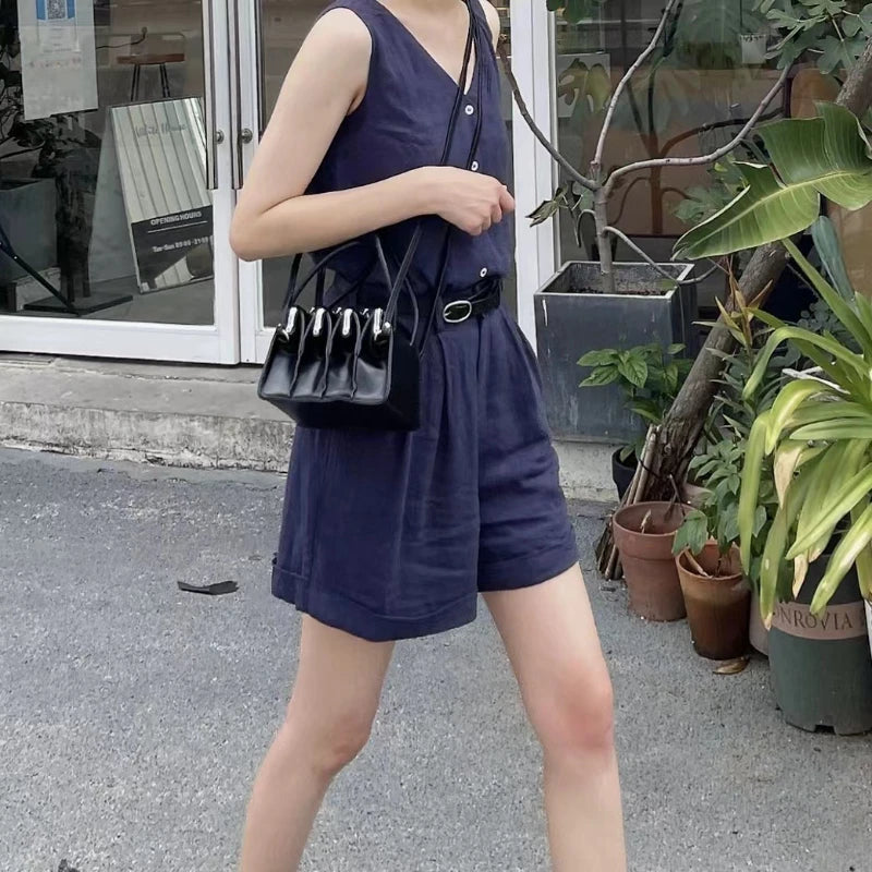 Black multi-layer shell clip handbag for women, featuring a sleek design, from Corporación Turística.