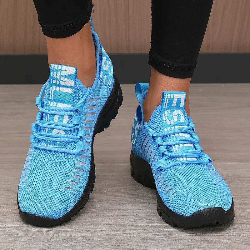 Black men's running shoes with breathable mesh design by Corporación Turística, showcasing sporty sneaker style and comfortable fit.