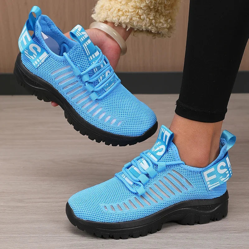 Black men's 2025 fashion mesh running shoes by Corporación Turística with breathable design and sporty style.