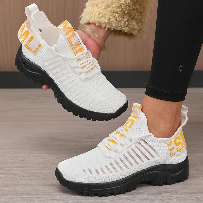 Black men's 2025 fashion mesh running shoes by Corporación Turística, featuring breathable material and stylish design.