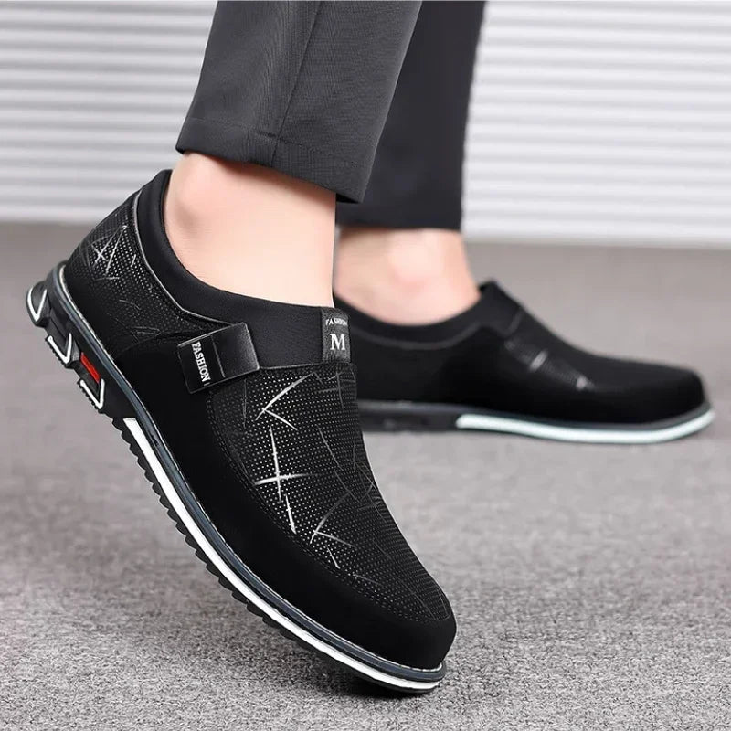 Luxury men's leather loafers by Corporación Turística in black, slip-on moccasins with sleek design and polished finish.