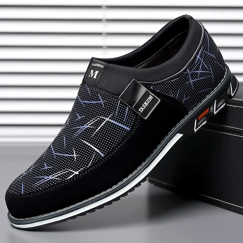 Black luxury leather men's moccasins without laces from Corporación Turística, stylish slip-on shoes for formal or casual wear.