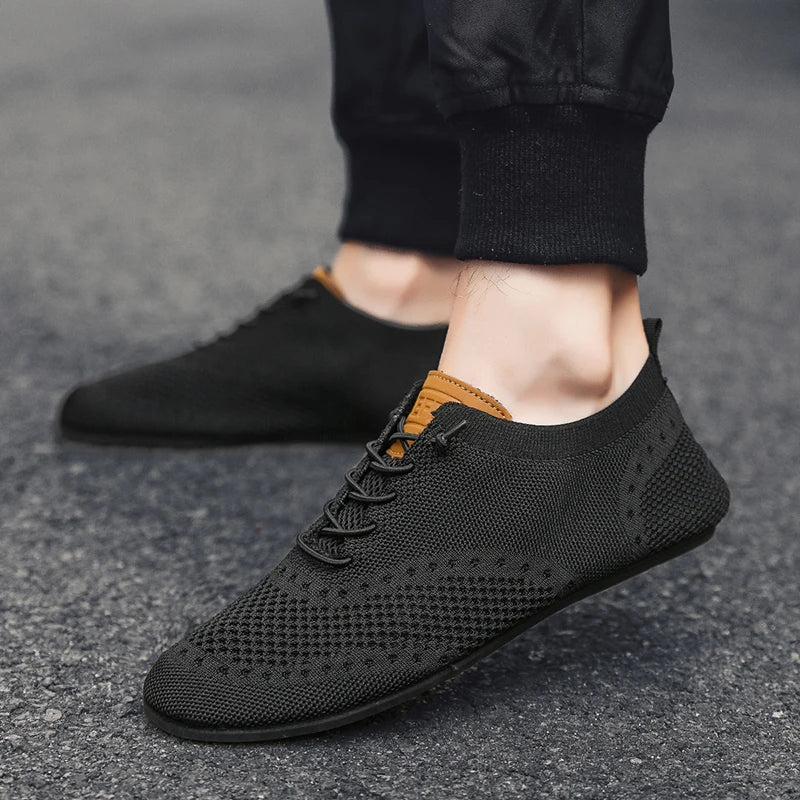 Black MAEDEF men's driving shoes by Corporación Turística, casual and comfortable for everyday wear.