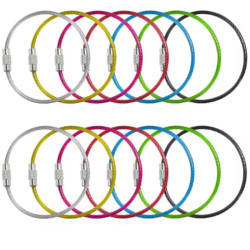 Set of five black stainless steel wire keychains with PVC coating from Corporación Turística, durable and stylish for everyday use.