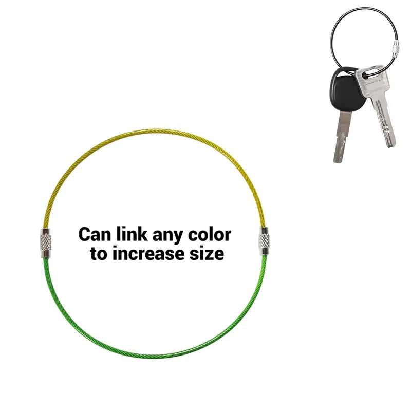 Set of five black stainless steel wire keychains with PVC coating by Corporación Turística, featuring durable and flexible design.