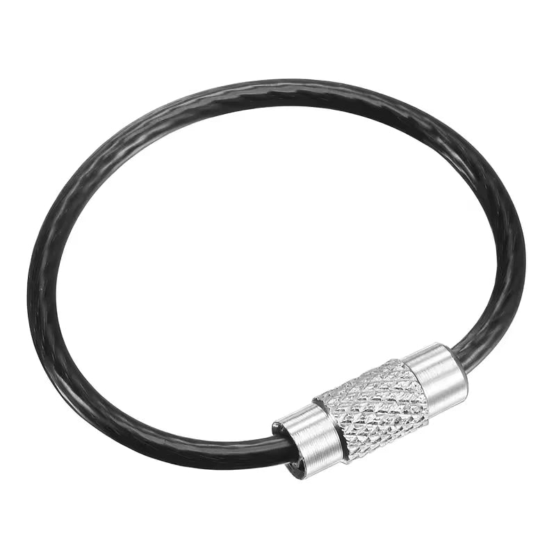 Set of five black stainless steel wire keychains with PVC coating, featuring durable and lightweight design from Corporación Turística.