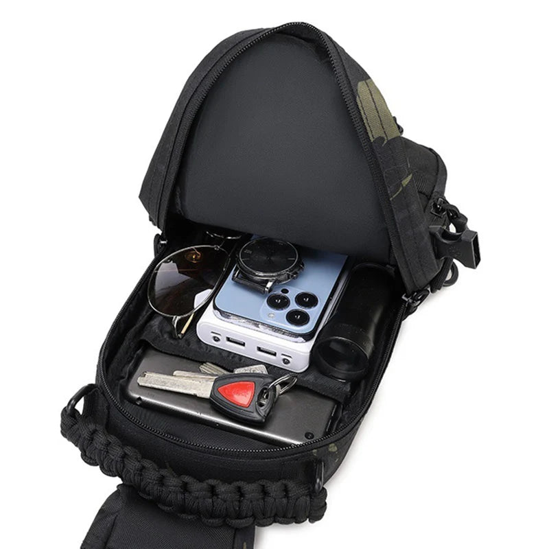 Black tactical chest bag for camping, men's hiking backpack by Corporación Turística, compact and durable outdoor gear.