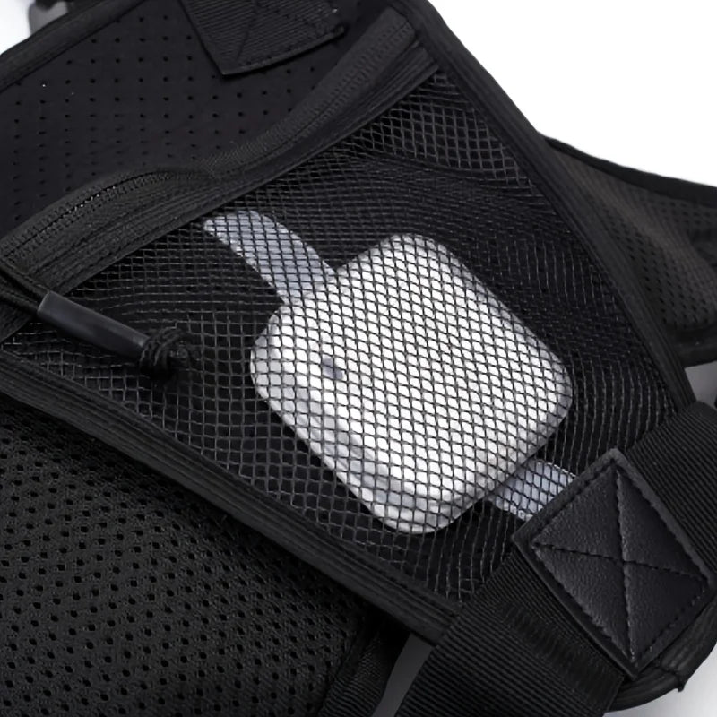 Black tactical vest with chest bag and camping backpack from Corporación Turística, designed for outdoor adventures and tactical use.