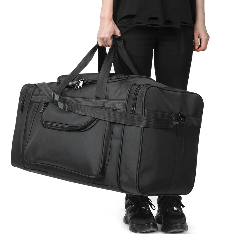 Large travel bag for men and women by Corporación Turística, sports-style black duffel bag with spacious design.