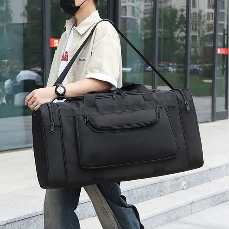Large travel bag for men and women by Corporación Turística, sports-style black duffel bag with multiple compartments.