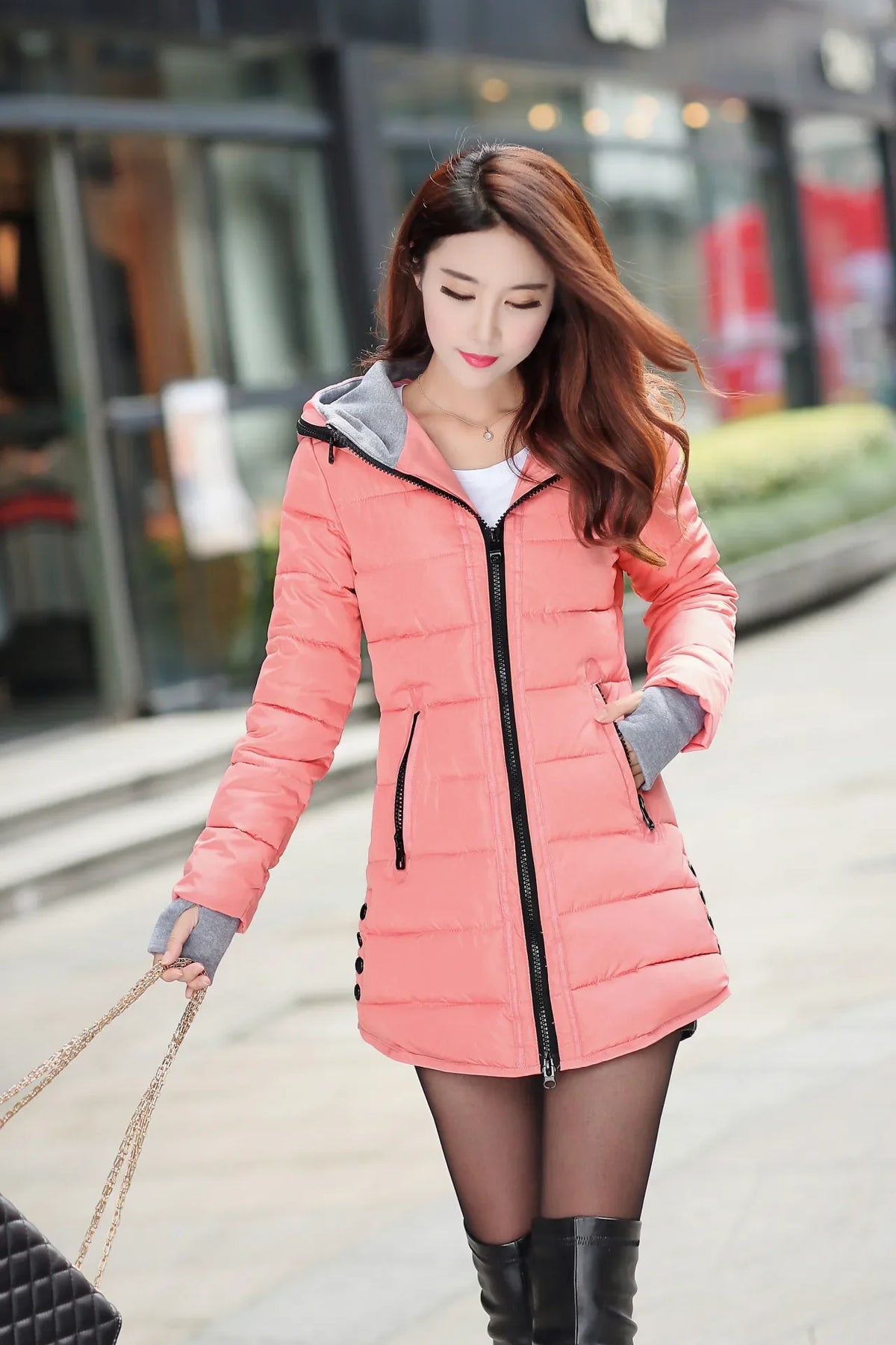 Black fashionable women's casual gloves paired with a fitted jacket, emphasizing stylish, everyday winter accessories.