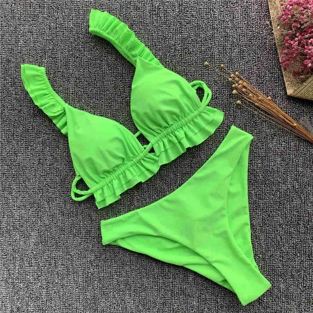 Black women's bikini swimsuit with ruffle details, 2026 collection, featuring a stylish and comfortable two-piece design.