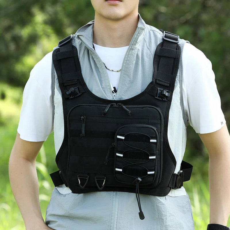 Black hydration running and cycling vest by Corporación Turística with adjustable straps and multiple storage pockets.