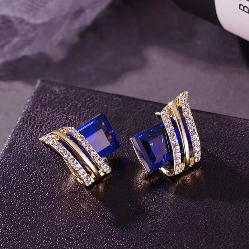 Black crystal zircon diamond-shaped wing earrings for women, designed by Corporación Turística, featuring elegant geometric style.