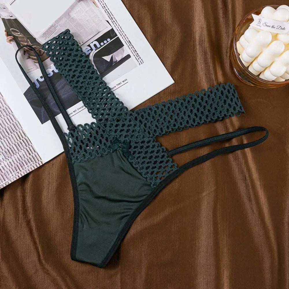 Black and white low-rise tanga with cutouts, comfortable style from Corporación Turística, shown on a mannequin.