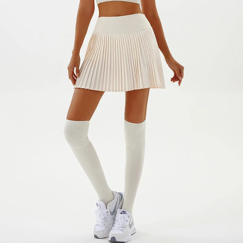Black sexy yoga shorts with a pleated skirt design from Corporación Turística, ideal for fitness and active wear.