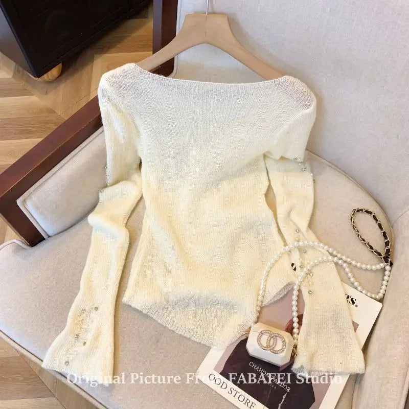Black women's sweater with a hollow design and bead hole pattern, stylish and cozy from Corporación Turística.