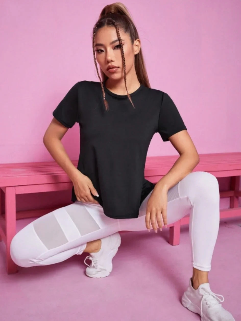 Black women's yoga suit with summer sports T-shirt from Corporación Turística, featuring comfortable, breathable fabric for active wear.
