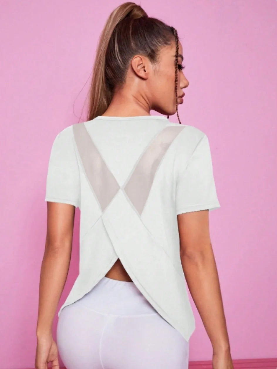 Black women's yoga suit with summer sports t-shirt by Corporación Turística, featuring breathable fabric and comfortable fit.