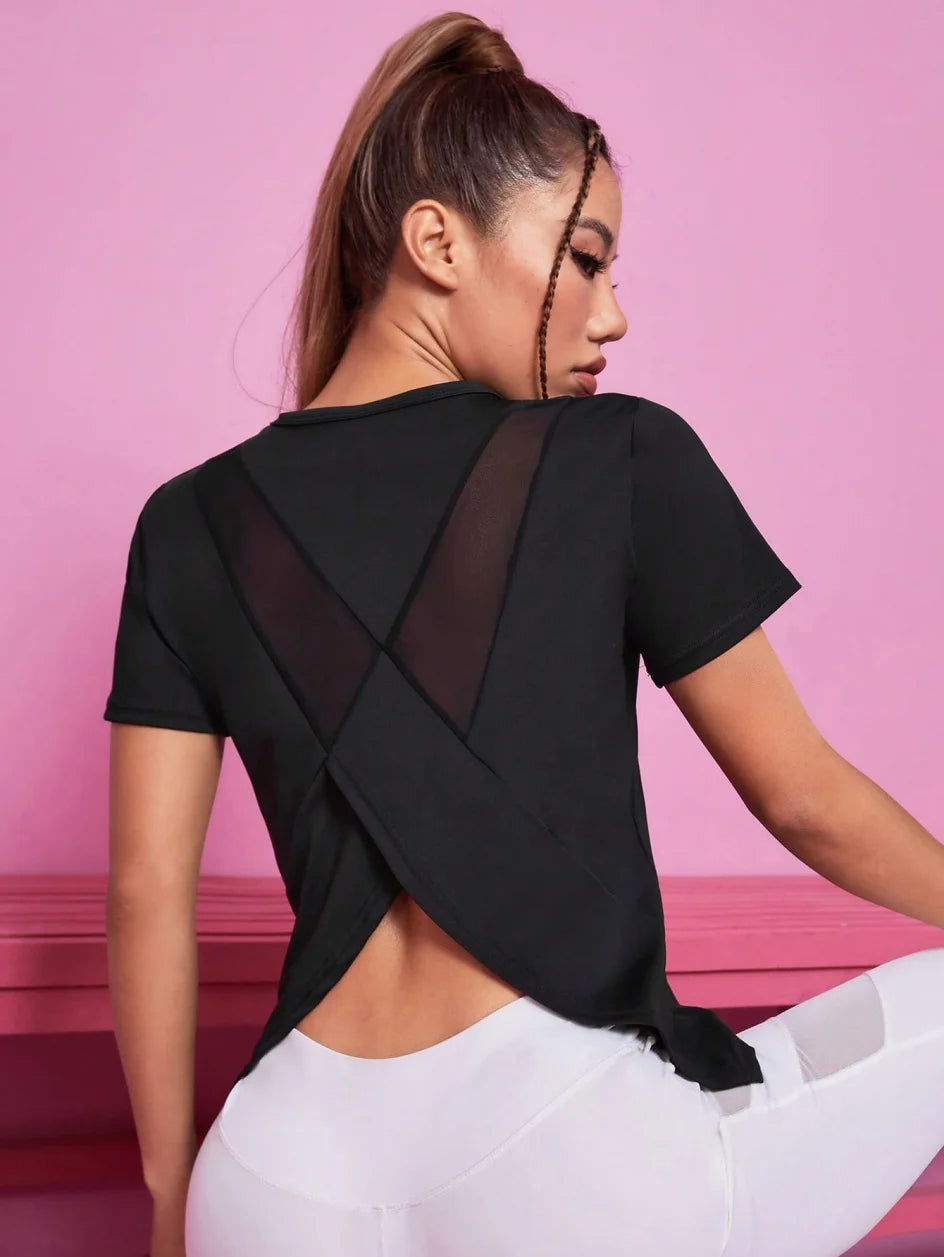 Black women's yoga outfit featuring a summer sports T-shirt from Corporación Turística, designed for active comfort.