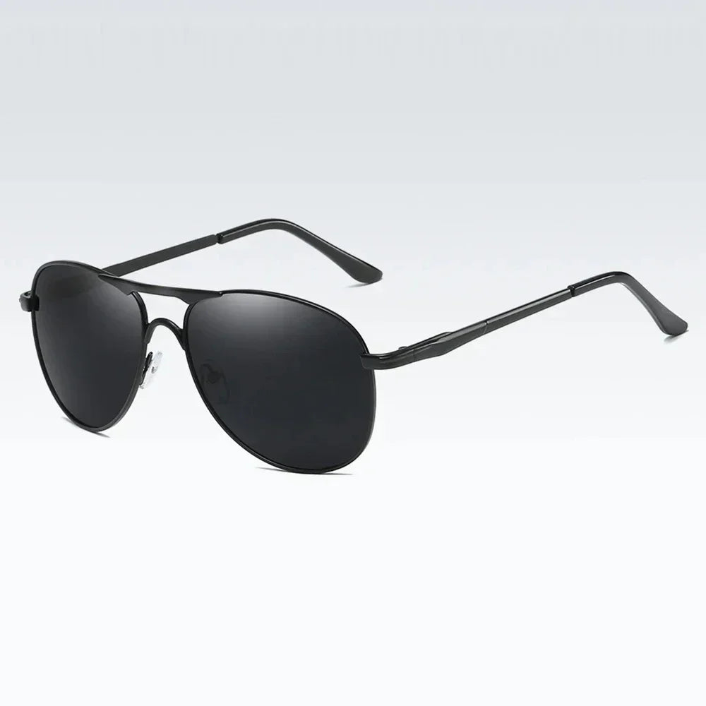 Luxury polarized sunglasses for men and women by Corporación Turística, featuring sleek black and silver-gray frames.
