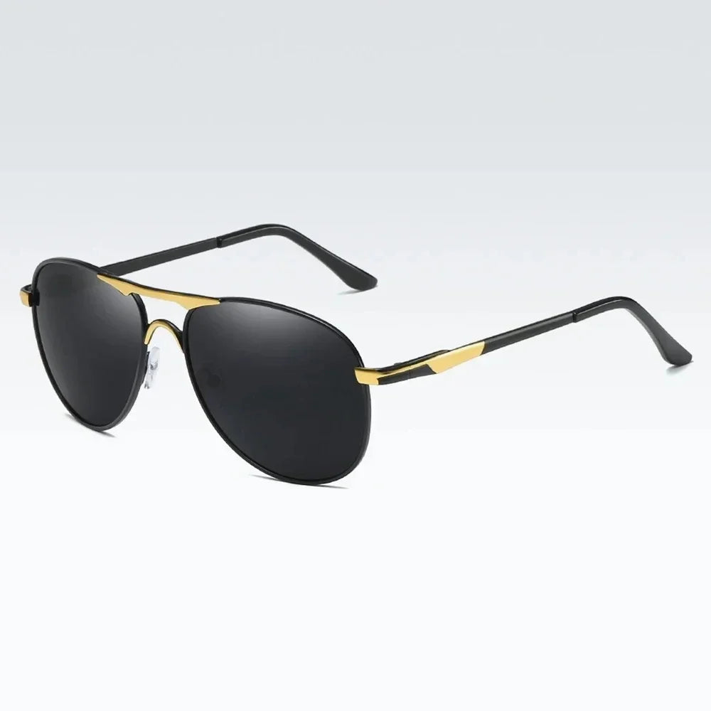 Luxury polarized sunglasses for men and women by Corporación Turística, featuring black and silver-gray frames and tinted lenses.
