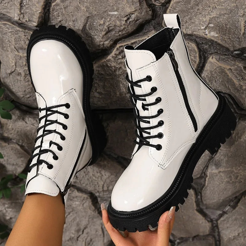 Black women's ankle boots by Corporación Turística, versatile and stylish with a sleek design and comfortable fit.