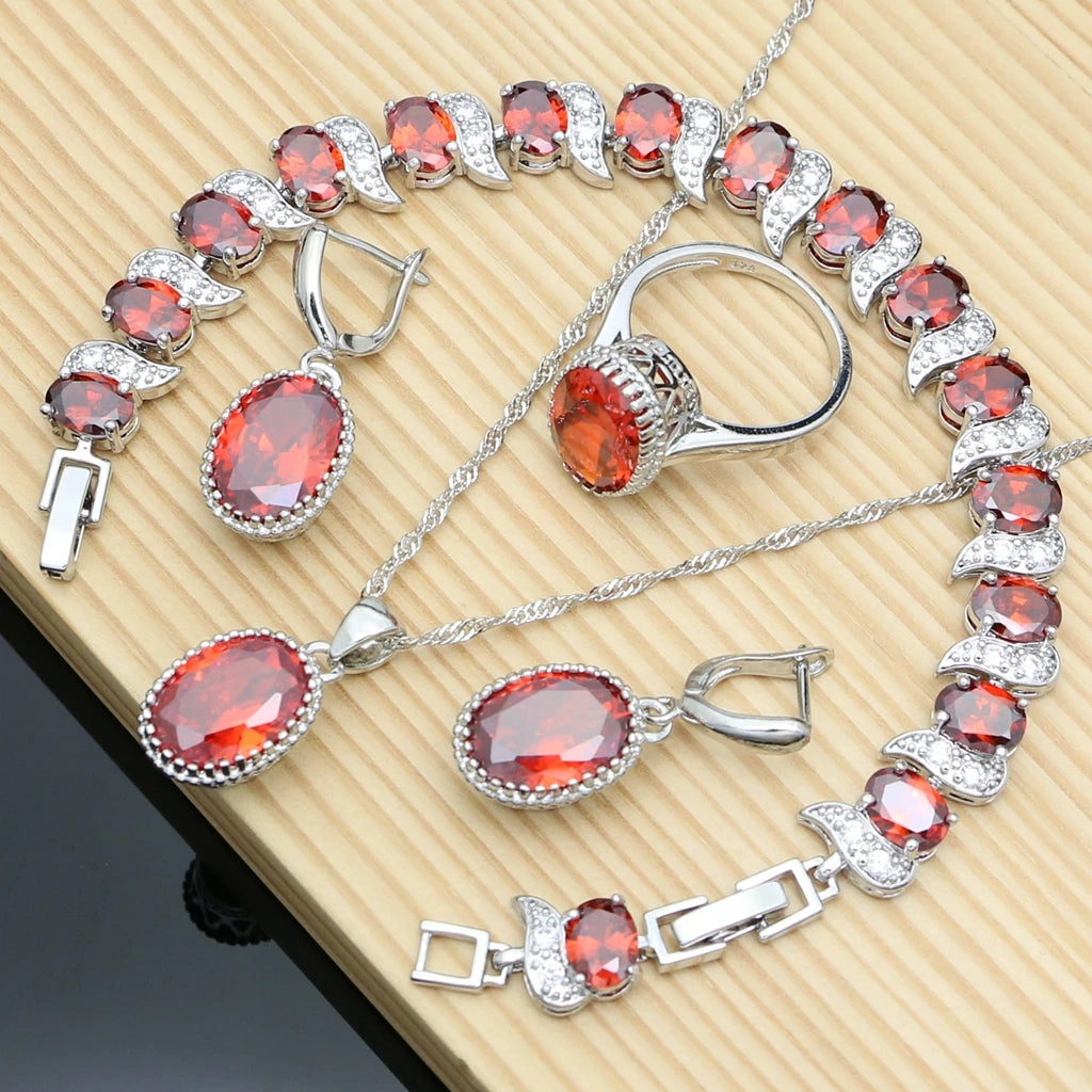 Silver 925 jewelry set for women with pendant and earrings, featuring natural silver design in a white background.