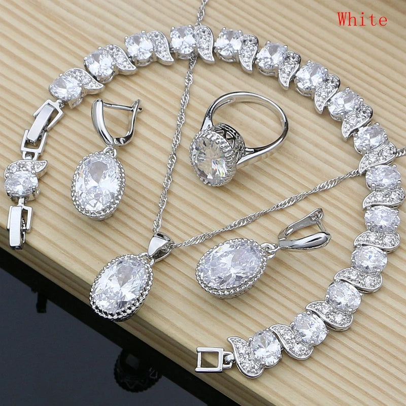 Silver 925 jewelry set for women featuring natural silver pendants and matching accessories, styled elegantly.