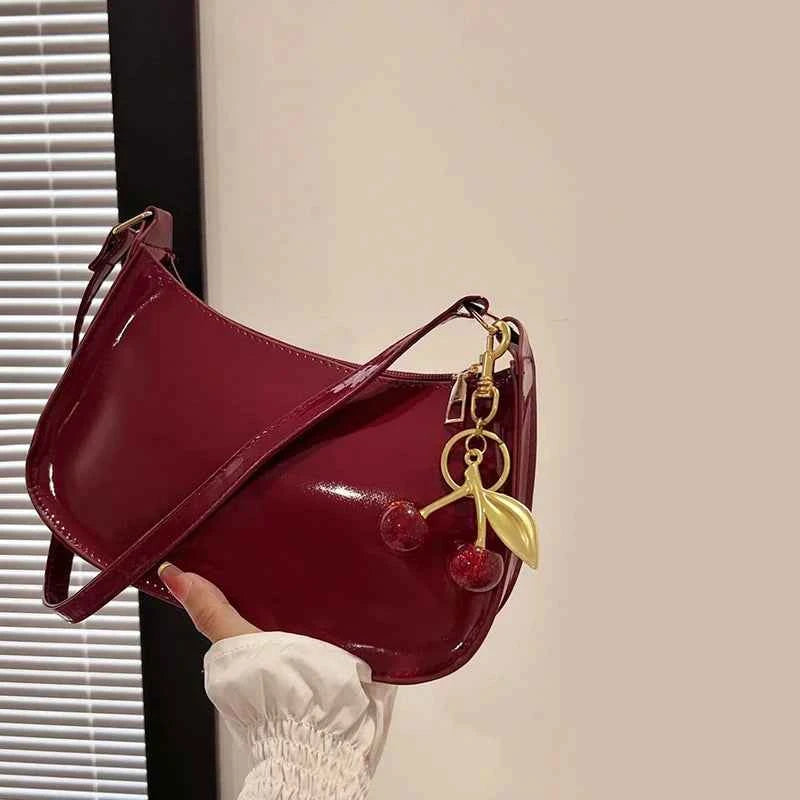 White synthetic leather women's shoulder handbag by Corporación Turística, featuring a sleek, stylish design for everyday use.