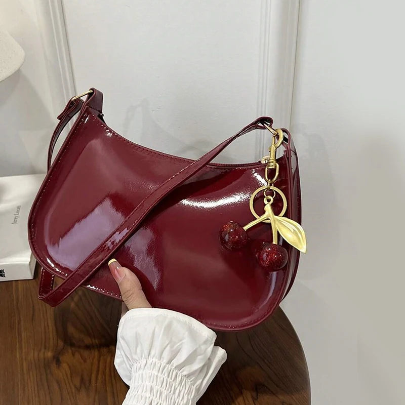 White synthetic leather women's handbag by Corporación Turística, stylish shoulder bag with a sleek design and top handle.